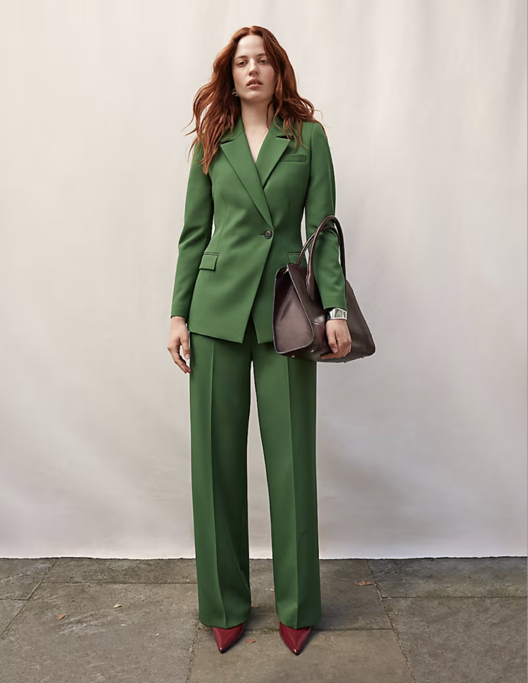 A model from the M&S site wearing a green pantsuit